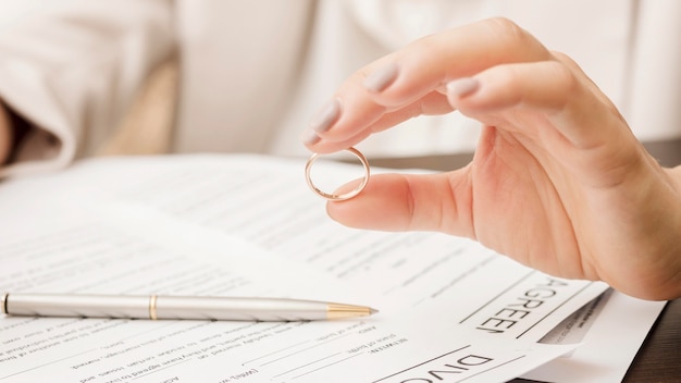 Close-up hand holding wedding ring