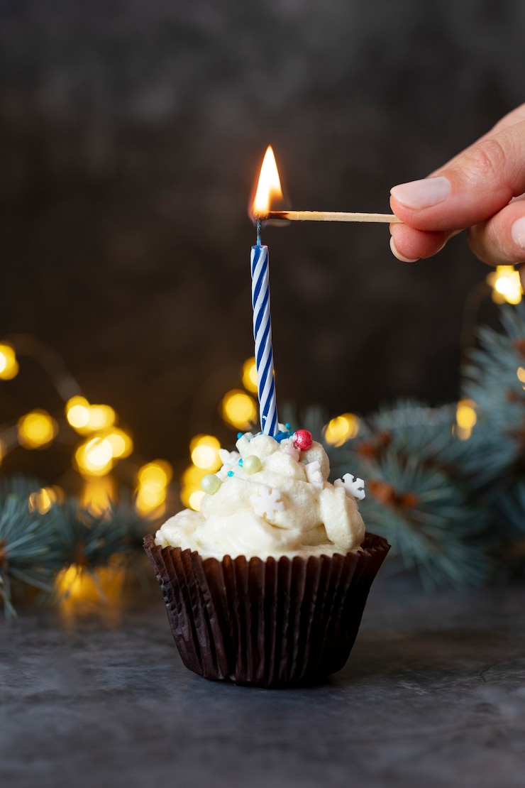 Free Photo close up hand lighting candle