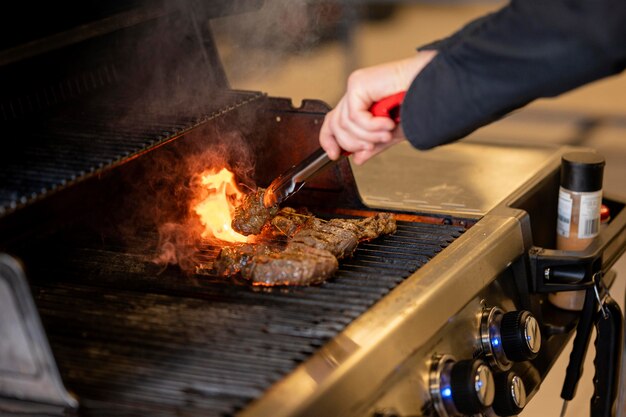 Close-up hand making barbeque