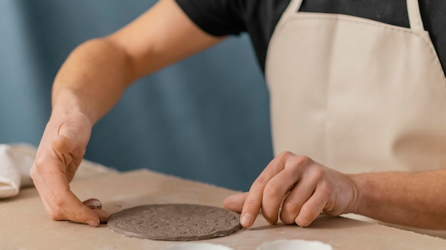 Close-up hand making plate