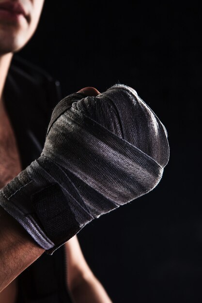 Close-up hand of muscular man with bandage