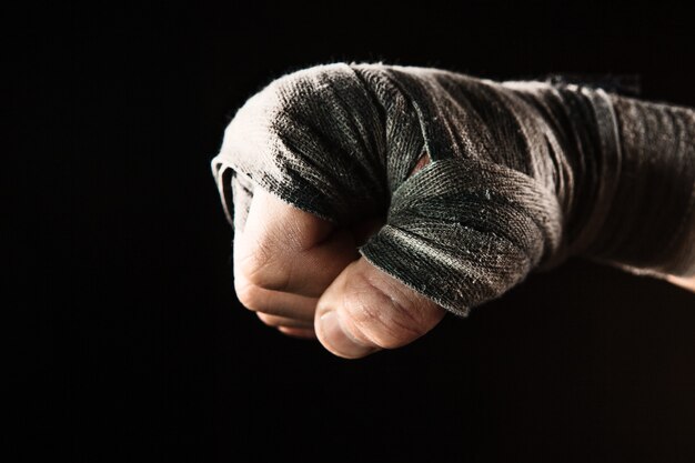 Close-up hand of muscular man with bandage