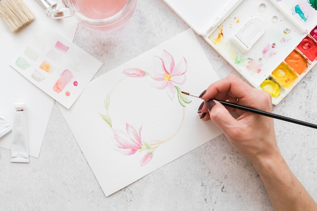 Close-up hand painting flowers