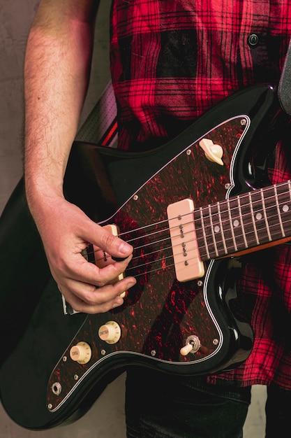 Close-up hand playing beautiful guitar