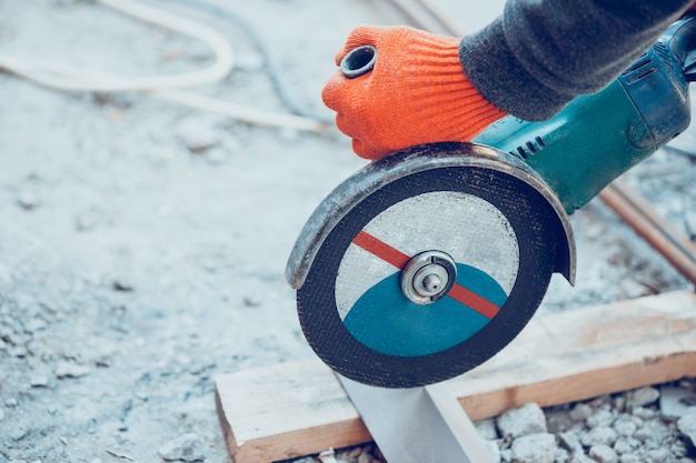 Close up of hand of repairman, professional builder working indoors, repairing