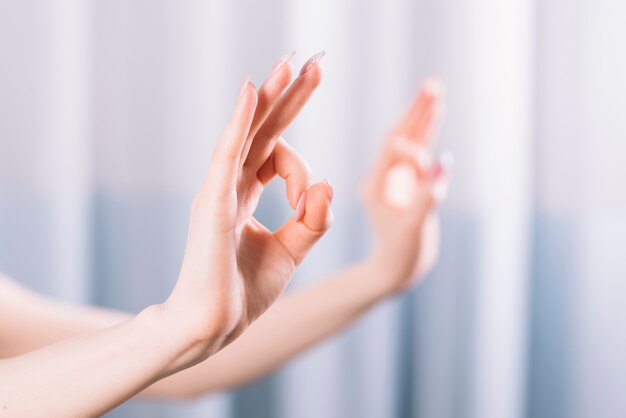 Close-up of hand showing gyan mudra gesture