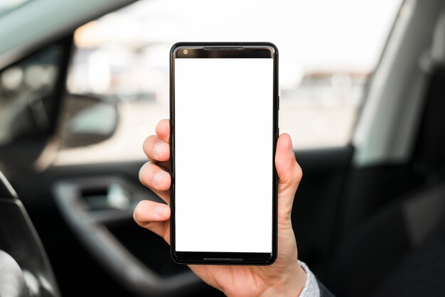 Close-up of hand showing mobile phone with white screen display