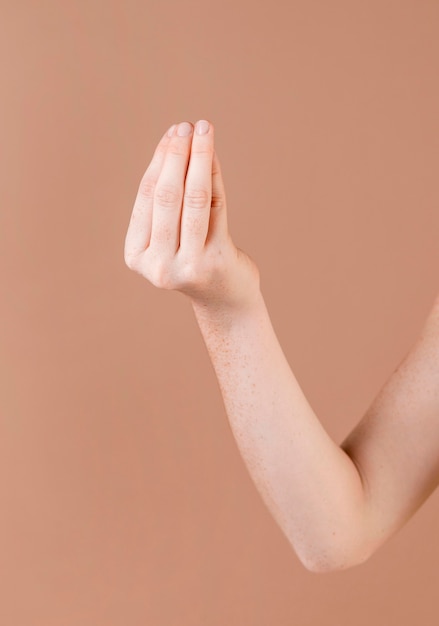 Close up of a hand teaching sign language