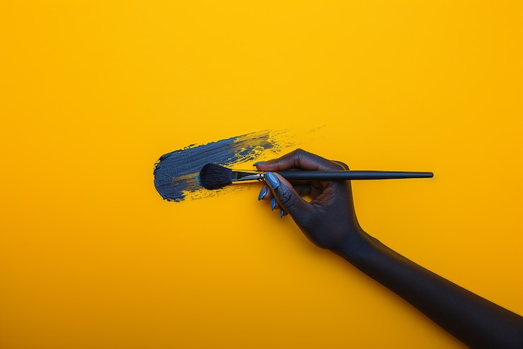 Free Photo close up on hand touching paint brush