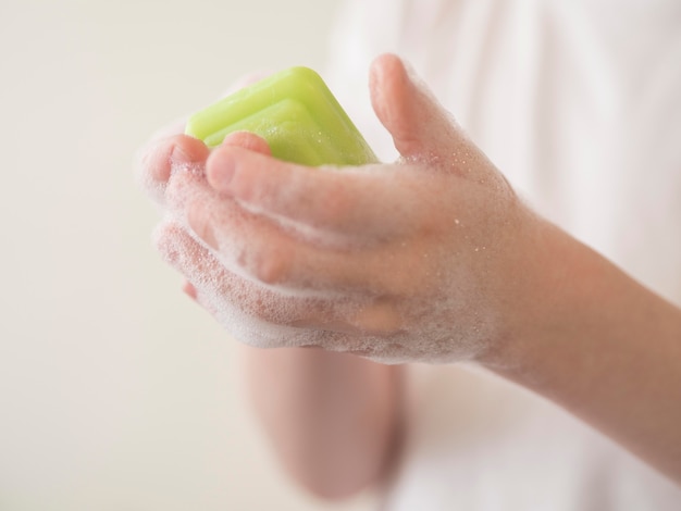 Close-up hand washing with soap