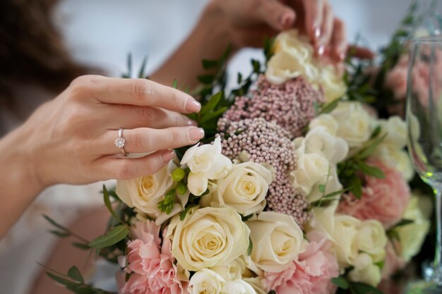 Close up hand wearing engagement ring