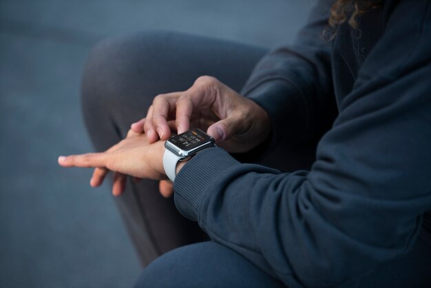 Close up hand wearing watch