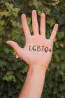 Free photo close-up hand with gay pride initials