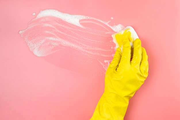 Free photo close-up hand with glove cleaning up