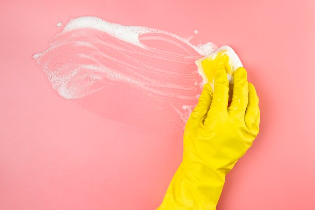 Close-up hand with glove cleaning up