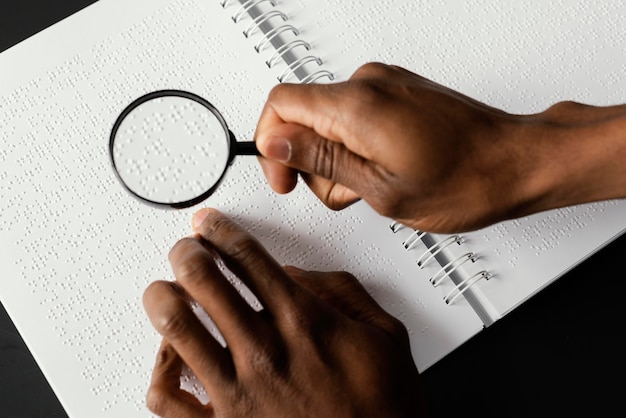 Close up hand with magnifying glass