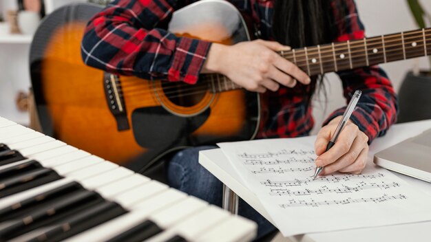 Close-up hand writing a song