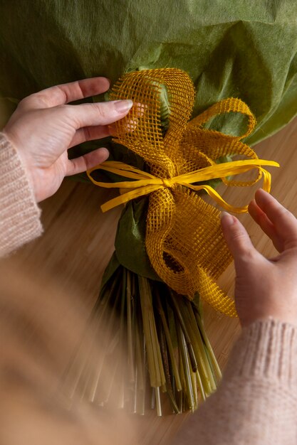 Free photo close up hands arranging ribbons