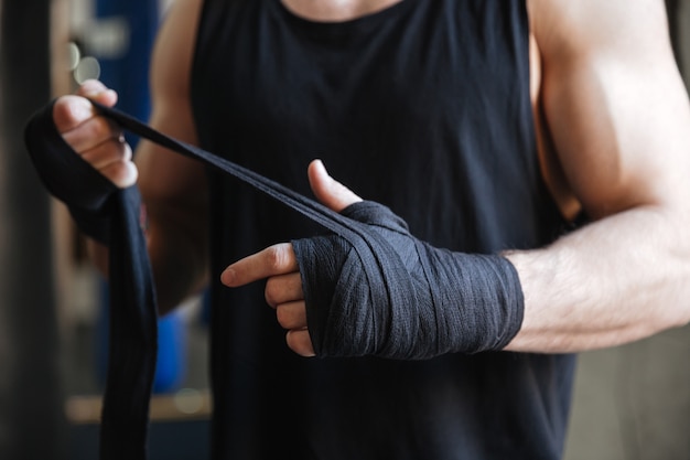 Free photo close up of hands of boxer in gloves