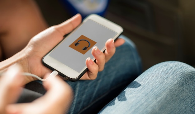 Close up of hands charging mobile phone