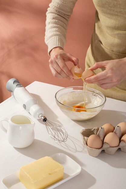 Close up hands cracking an egg