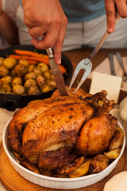Close-up hands cutting tasty turkey