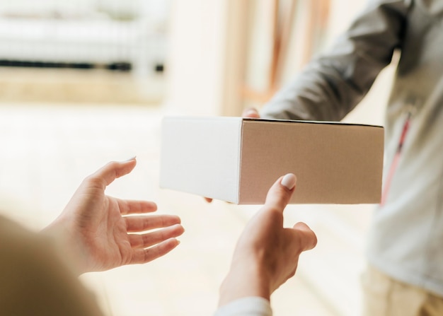 Close-up hands getting box