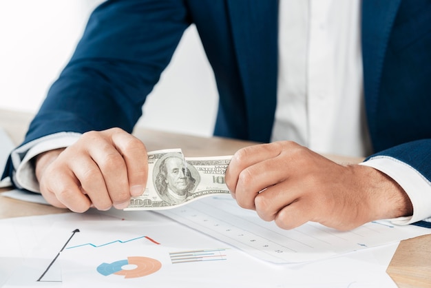 Close-up hands holding banknote