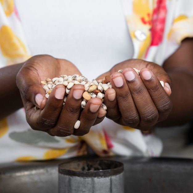 Close-up hands holding beans