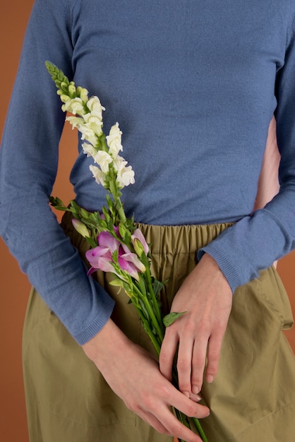 Close up hands holding beautiful flowers