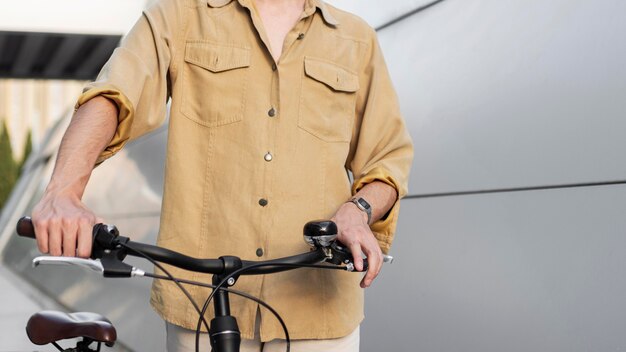 Close-up hands holding bike's handlebars