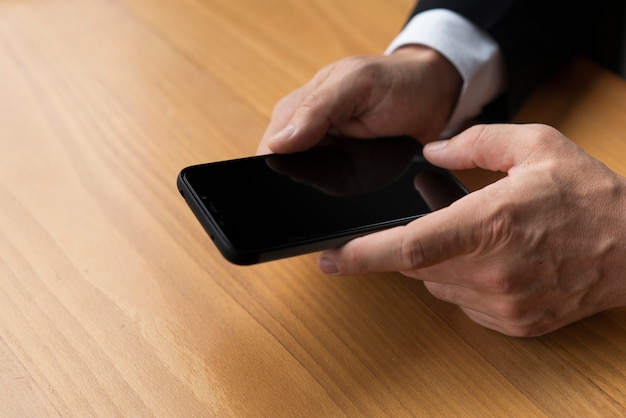 Close up hands holding blank smartphone