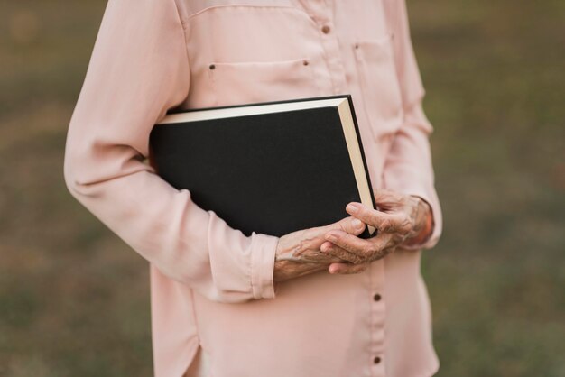 Close-up hands holding book