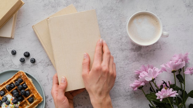 Free photo close up hands holding books