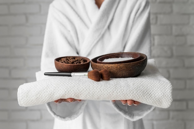 Free photo close-up hands holding bowls with remedies