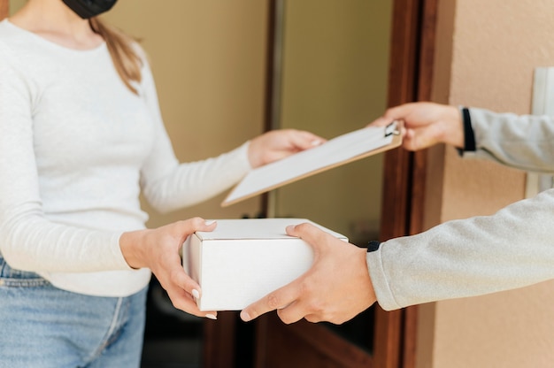 Close-up hands holding box