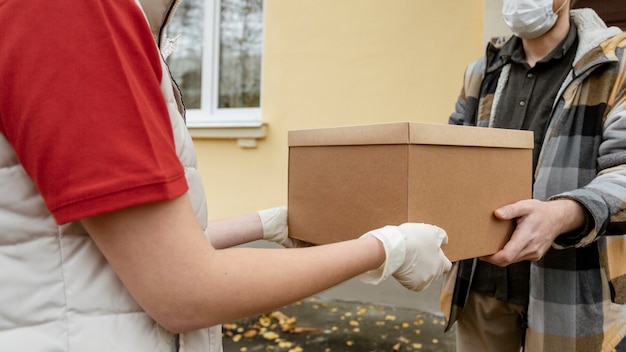 Close-up hands holding box