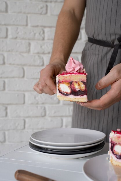 Close up hands holding cake slice