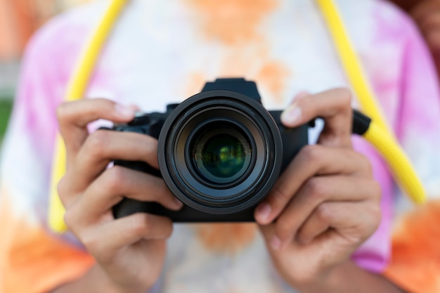 Close up hands holding camera