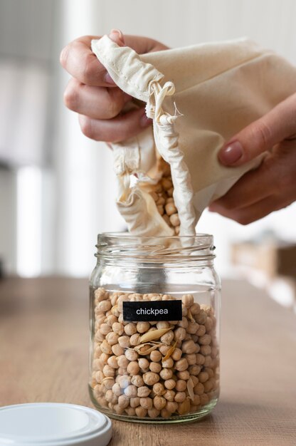 Close up hands holding chickpeas bag