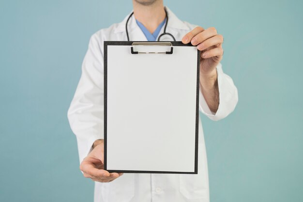 Close-up hands holding clipboard