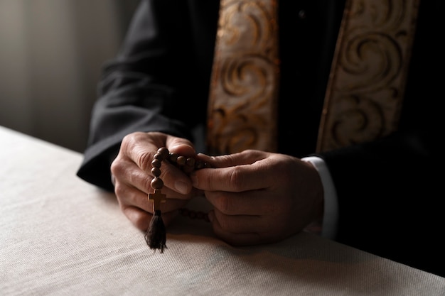 Close up hands holding crucifix