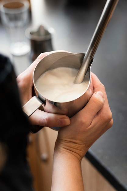 Free photo close up hands holding cup