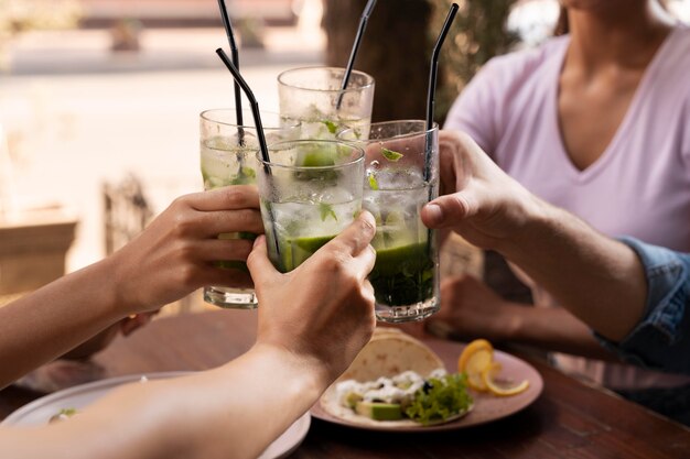 Close up hands holding cups