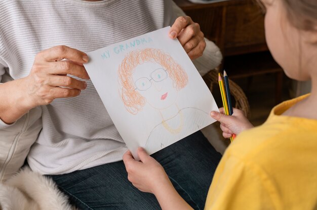 Close up hands holding cute drawing