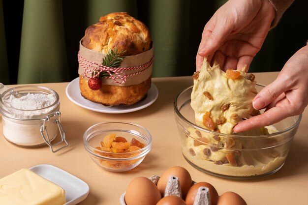 Close up hands holding dough