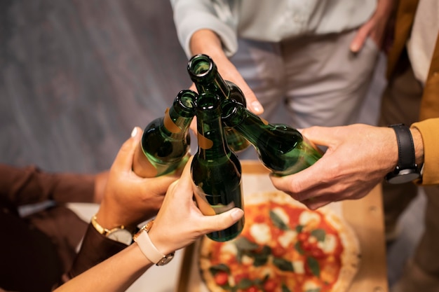 Free photo close up hands holding drinks