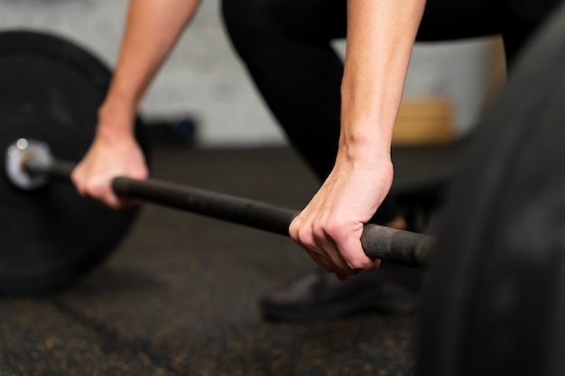 Close up hands holding dumbbell