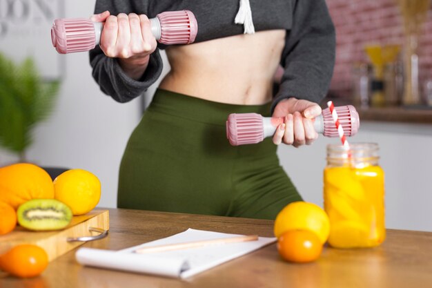 Close up hands holding dumbbells