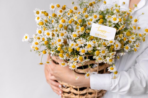 Close up hands holding flower bouquet